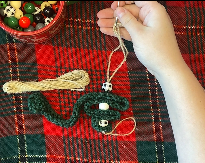 Beads and Crochet Strip threaded with twine with plaid background